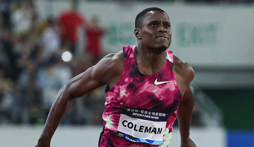 Christian Coleman reacts after narrowly edging out Kenya's Ferdinand Omanyala at Prefontaine Classic