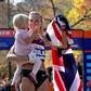 Paula Radcliffe celebrates marathon victory, holding her young daughter, wrapped in the British flag