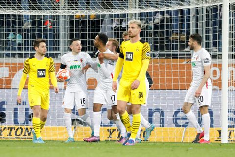 Dortmund held at Augbsurg to leave Bayern eight points clear