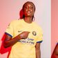 Super Falcons star Ifeoma Onumonu models Utah Royals Gold and 'Mountain Heir' Blue Kits.