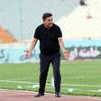 Iran coach on the touchline.