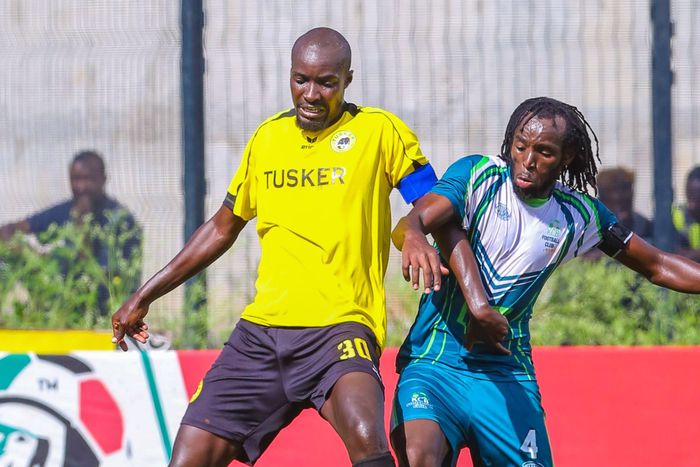 Humphrey Mieno shielding the ball from Michael Mutinda.