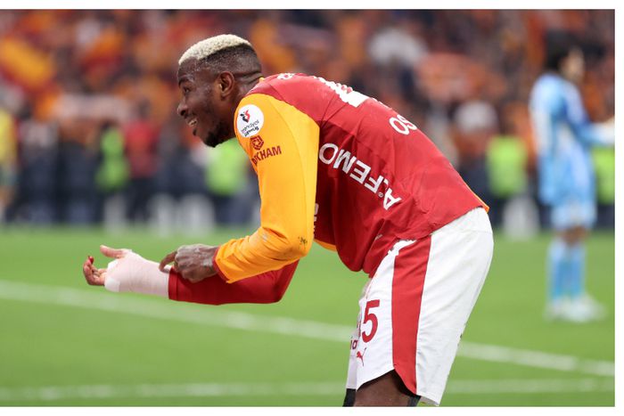 Osimhen gestures at his hand protection