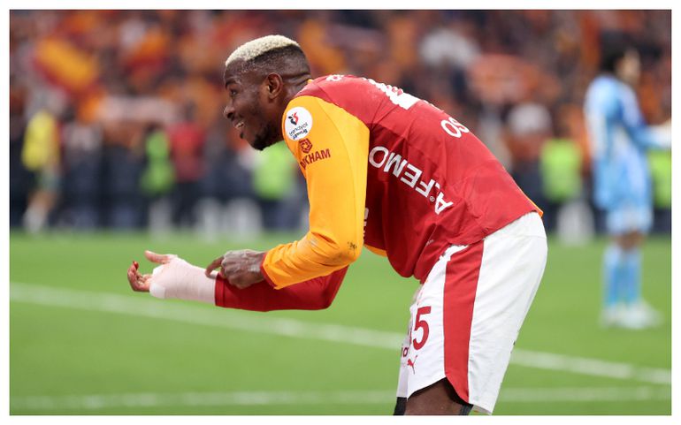 Osimhen gestures at his hand protection