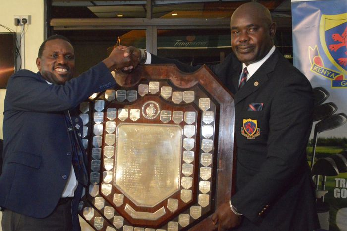 Outgoing KGU chairman Njani Ndiritu (L) with Philip Ochola (R)