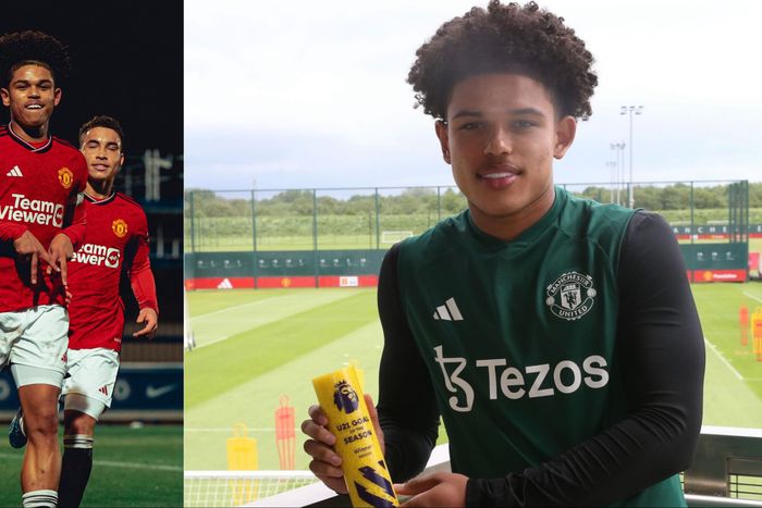 Nigerian-born star Shola Shoretire poses with PL 2 Goal of the Season Award for his strike in Manchester United's win against Chelsea.