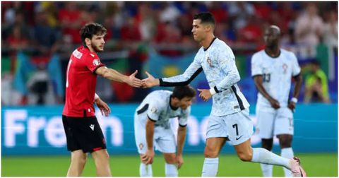 Ronaldo shakes Georgia star Kvicha Kvaratskhelia during the game between Georgia and Portugal