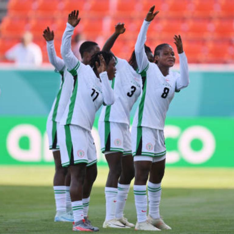 Faridat Abdulwahab celebraates a goal with her Falconets teammates.