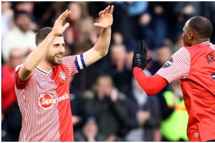 Joe Aribo celebrates with Armstrong, who assisted his first goal of the season.