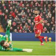 Mohamed Salah scores the history goal for Liverpool.