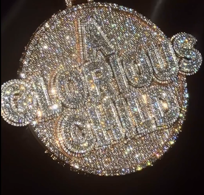 Super Eagles star Victor Osimhen celebrates Nigeria with new new diamond pendant and ring.