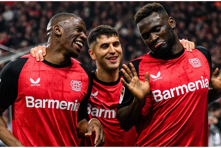 Victor Boniface (right) celebrates with his teammates.