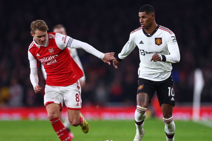 Manchester United forward Marcus Rashford and Martin Odegaard.