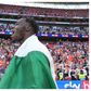 Elijah Adebayo celebrates with the Nigerian flag after the win.