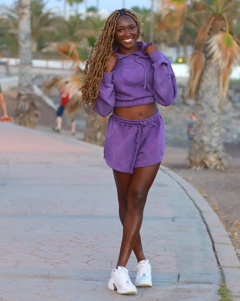 Super Falcons of Nigeria star Rinsola Babajide shows off style in purple outfit.