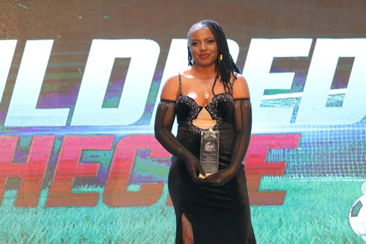 Junior Starlets coach Mildred Cheche reacts after receiving FKF President's award following historic World Cup achievement