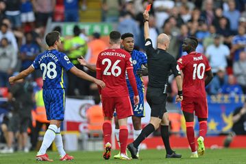 Liverpool held by 10-man Chelsea, Man City pile on misery for Arsenal