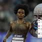 Sha'Carri Richardson lets out her natural hair in training as boyfriend Christian Coleman beams with pride