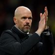 Manchester United manager Erik ten Hag applauds during FA Cup match at Old Trafford.