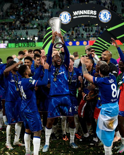 Tosin Adarabioyo lifts the Europa Conference League with Chelsea.