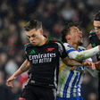 Joao Pedro of Brighton and Hove Albion is challenged by Leandro Trossard (L) and Riccardo Calafiori of Arsenal during the Premier League match at the AMEX Stadium, Brighton and Hove. Picture credit : Paul Terry