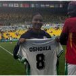 Vicky Lopez holds up Asisat Oshoala's kit after the Paris 2024 Nigeria vs Spain clash.