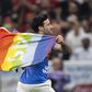 Pitch invader displays rainbow flag during the Portugal vs Uruguay match