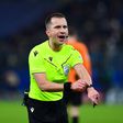 Referee Frankowski Bartosz points at his watch during the UEFA Champions League game between Shakhtar Donetsk and Royal Antwerp FC