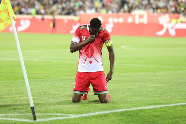 Harambee Stars striker and captain Michael Olunga in action against Iran.