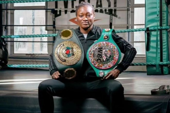 Nigerian boxer Elizabeth Oshoba shows off  WBC title.