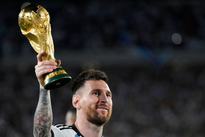 Lionel Messi lifts the 2022 World Cup Trophy after Argentina won