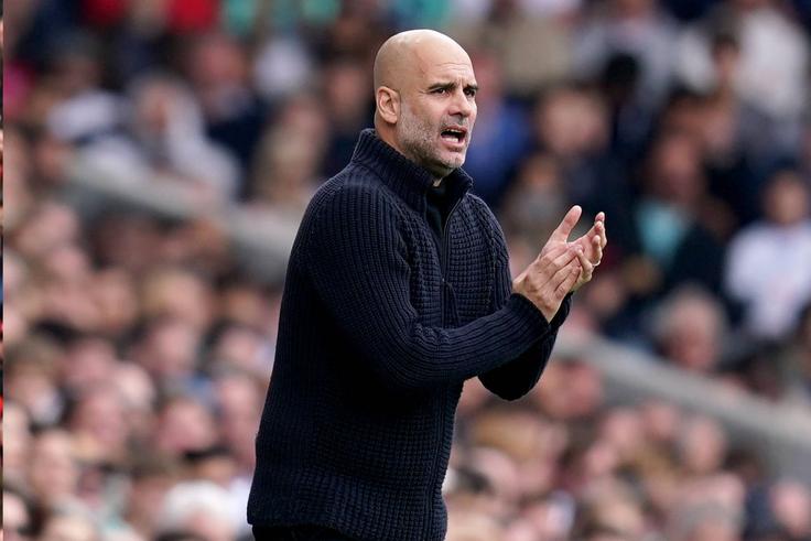 Pep Guardiola applauds Manchester City players after victory over Fulham.