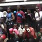 WKF of Kenya president Japheth Yahuma (second from the L, standing), poses for a photo with boxers.