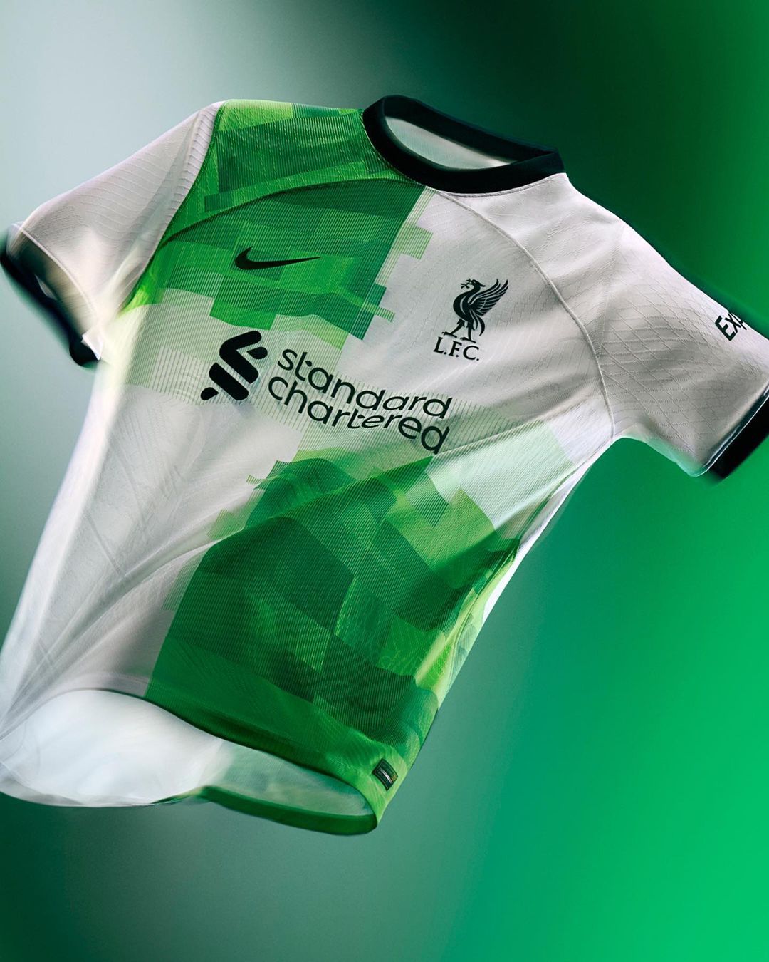 Salah models Liverpool's 'Super Eagles' Green and white away kit