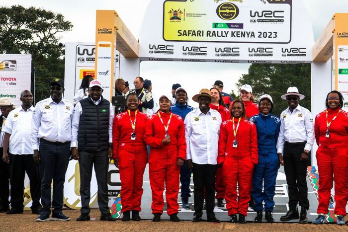 All-women crew of rally drivers pose for a photo
