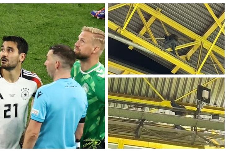 Masked man climbs roof of Dortmund stadium