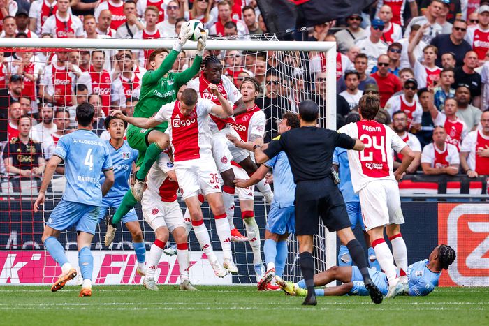 Goalkeeper Robin Roefs of NEC jumping to catch the ball, Dies Janse of AFC Ajax, Chuba Akpom of AFC Ajax, Wout Weghorst of AFC Ajax during the Dutch Eredivisie match between AFC Ajax and NEC at Johan Cruijff ArenA on May 11, 2025