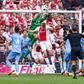 Goalkeeper Robin Roefs of NEC jumping to catch the ball, Dies Janse of AFC Ajax, Chuba Akpom of AFC Ajax, Wout Weghorst of AFC Ajax during the Dutch Eredivisie match between AFC Ajax and NEC at Johan Cruijff ArenA on May 11, 2025
