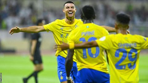 Cristiano Ronaldo and Sadio Mane celebrating a goal for Al Nassr