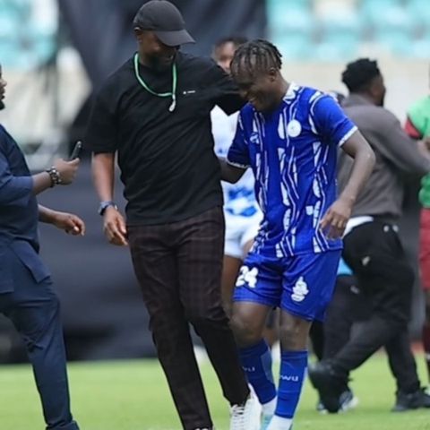 Finidi George celebrates the CAF Champions League progress with one of his players. (Photo Credit: Finidi George)