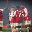 Arsenal players celebrating a goal in the Champions League game against RC Lens