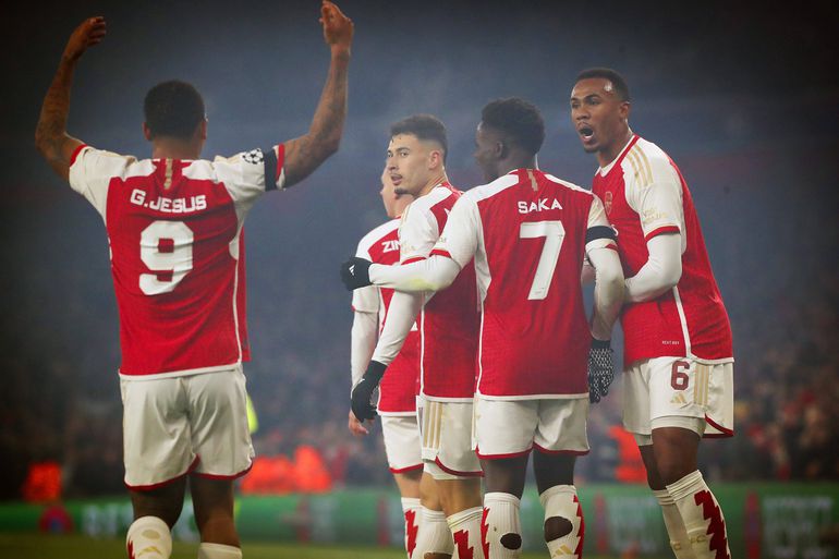 Arsenal players celebrating a goal in the Champions League game against RC Lens