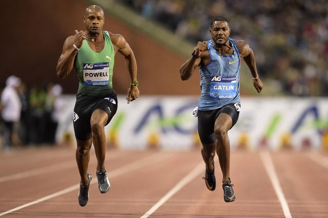ustin Gatlin gives former track rival Asafa Powell his flowers