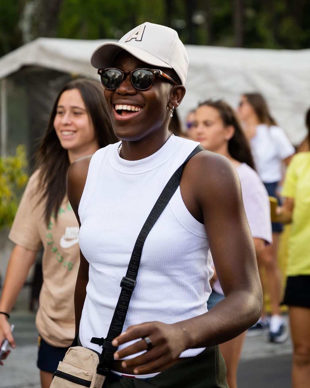 Wearing an armless shirt to go with a face cap Oshoala showed off her style with teammates on a merry-go-round. Image Credit - Twitter/Barcelona Femeni