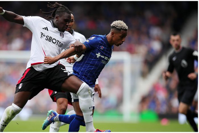 Calvin Bassey tackles an Ipswich player.