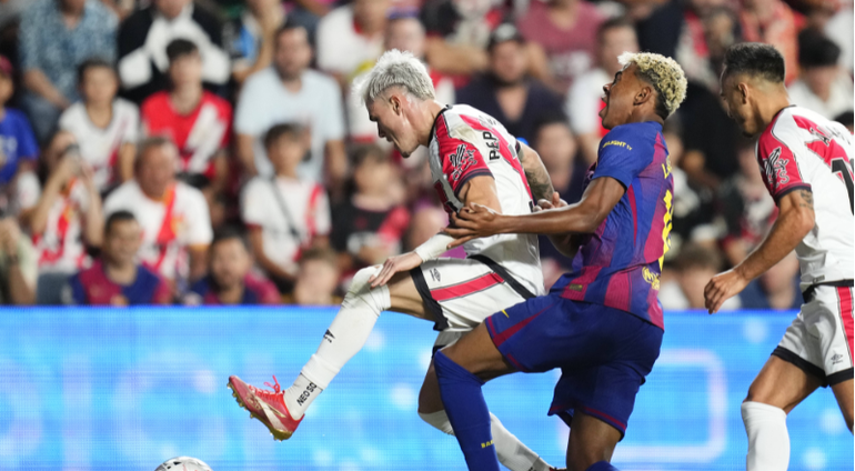 Pep Chavarria of Rayo Vallecano in action against Lamine Yamal of Barcelona during the La Liga EA Sports match between Rayo Vallecano de Madrid and FC Barcelona at Estadio de Vallecas || Image credit: Imago