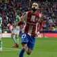 Carrasco helps fire Atletico past Real Betis
