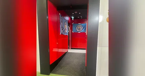 Man United slammed for allowing Man City staff to hang flags with rivals’ logos on Old Trafford corridors