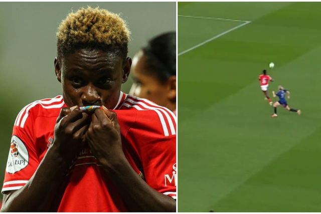 Nigerian midfielder Christy Ucheibe in a Benfica jersey making a tackle during a UEFA Women's Champions League match.