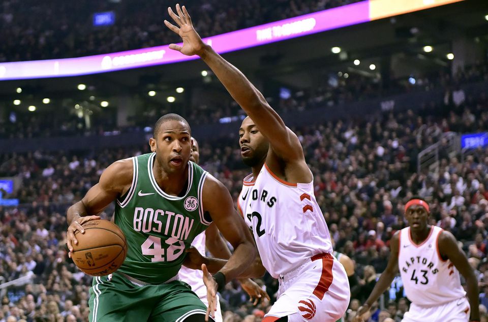 Toronto Raptors forward Kawhi Leonard (2) tries to screen Boston Celtics center Al Horford.